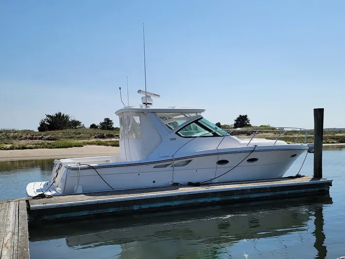 Yacht Photos Pics 2006 Tiara Yachts 3200 Open docked in calm waters under clear skies.