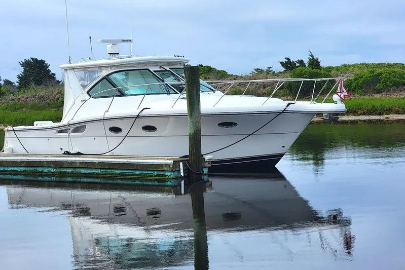  Yacht Photos Pics 2006 Tiara Yachts 3200 Open docked on calm water, reflecting serene surroundings.