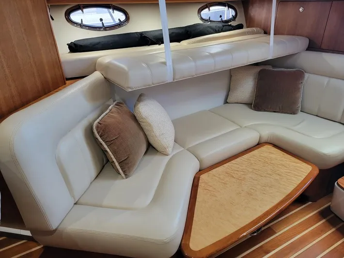  Yacht Photos Pics Luxurious interior of 2006 Tiara Yachts 3200 Open with plush seating and cushions.