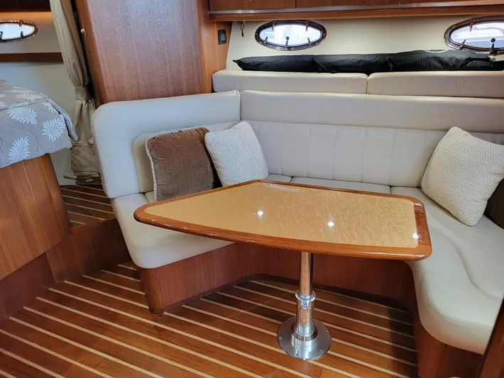  Yacht Photos Pics Interior of 2006 Tiara Yachts 3200 Open, featuring a cozy seating area with cushions.