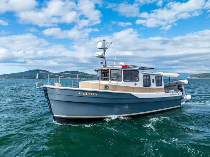 Caldonia Yacht Photos Pics 2013 Ranger Tugs R 29 boat cruising on open water under a blue sky.