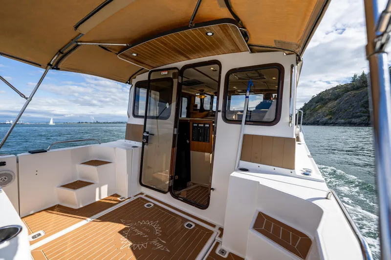 Caldonia Yacht Photos Pics 2013 Ranger Tugs R 29 boat interior with open deck, scenic water view.