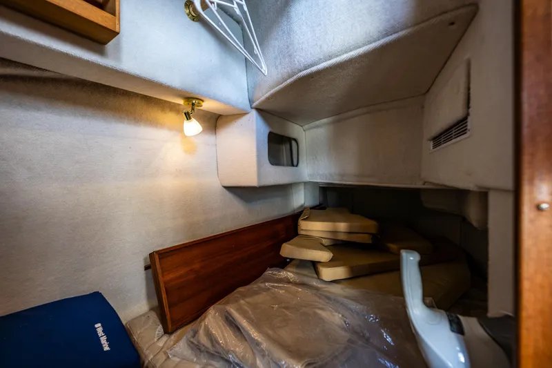 Caldonia Yacht Photos Pics 2013 Ranger Tugs R 29 cabin interior with cushions and soft lighting.