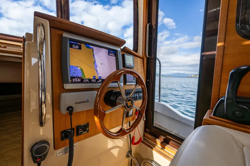Caldonia Yacht Photos Pics Interior view of 2013 Ranger Tugs R 29 boat with navigation system and steering wheel.