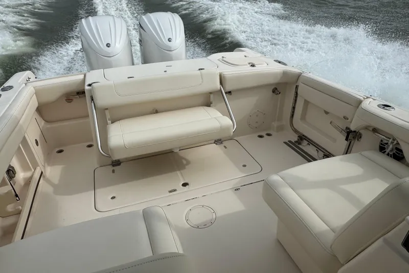 That's What She Said Yacht Photos Pics 2023 Grady-White Freedom 285 boat interior with twin engines and spacious seating.
