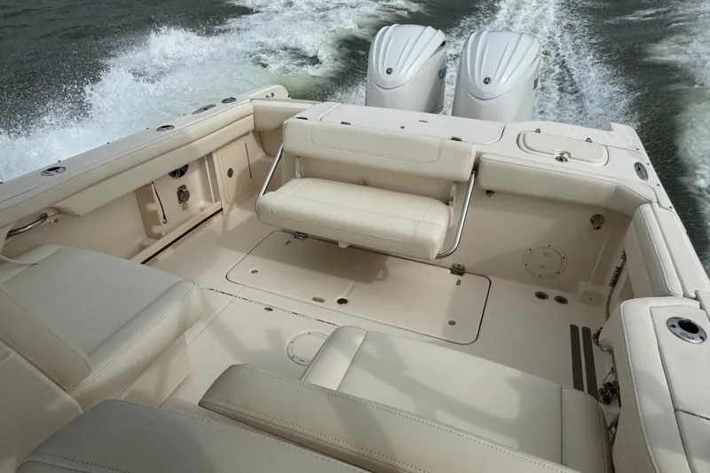That's What She Said Yacht Photos Pics 2023 Grady-White Freedom 285 boat interior with twin engines and spacious seating.