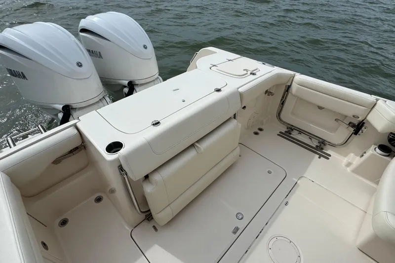 That's What She Said Yacht Photos Pics 2023 Grady-White Freedom 285 boat interior with twin Yamaha engines on water.