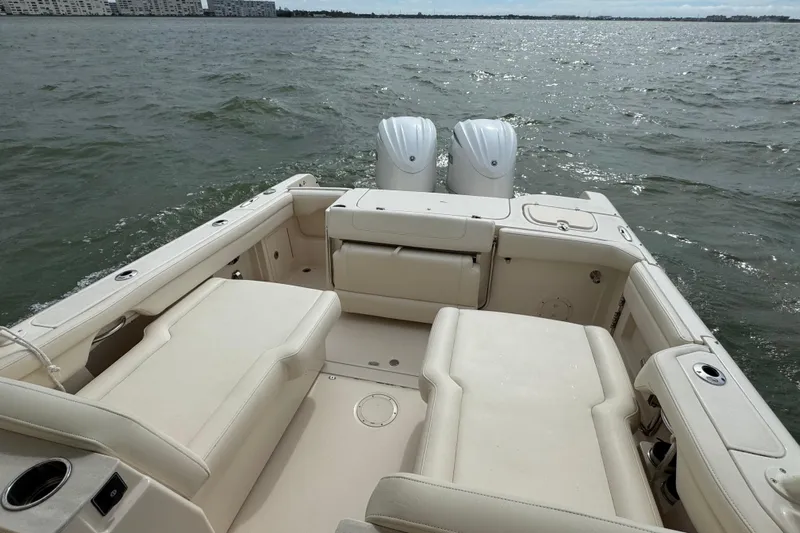 That's What She Said Yacht Photos Pics 2023 Grady-White Freedom 285 boat interior with twin engines on open water.