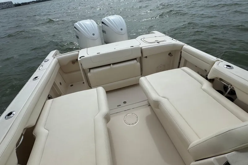 That's What She Said Yacht Photos Pics 2023 Grady-White Freedom 285 boat interior with twin engines on the water.