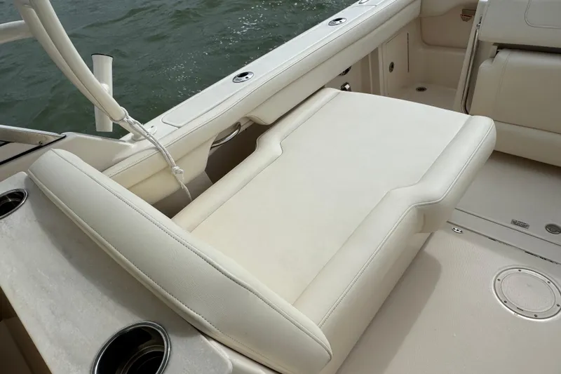That's What She Said Yacht Photos Pics 2023 Grady-White Freedom 285 boat interior with white cushioned seating.