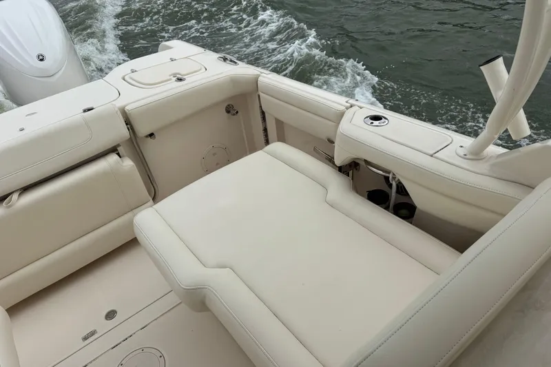 That's What She Said Yacht Photos Pics 2023 Grady-White Freedom 285 boat interior with cushioned seating and water view.