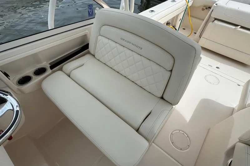 That's What She Said Yacht Photos Pics 2023 Grady-White Freedom 285 boat interior with luxurious seating and cup holders.