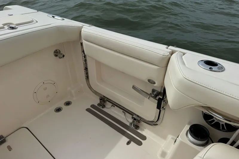 That's What She Said Yacht Photos Pics 2023 Grady-White Freedom 285 boat interior with white seating and ocean view.