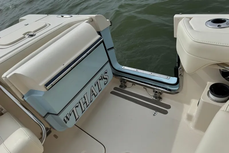 That's What She Said Yacht Photos Pics 2023 Grady-White Freedom 285 boat interior with open transom door, showing water view.