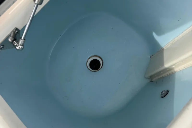 That's What She Said Yacht Photos Pics 2023 Grady-White Freedom 285 boat interior, featuring a blue livewell with drain.