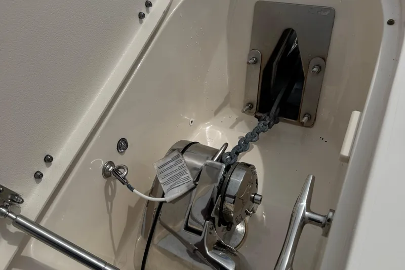 That's What She Said Yacht Photos Pics 2023 Grady-White Freedom 285 anchor system with chain and winch in boat compartment.