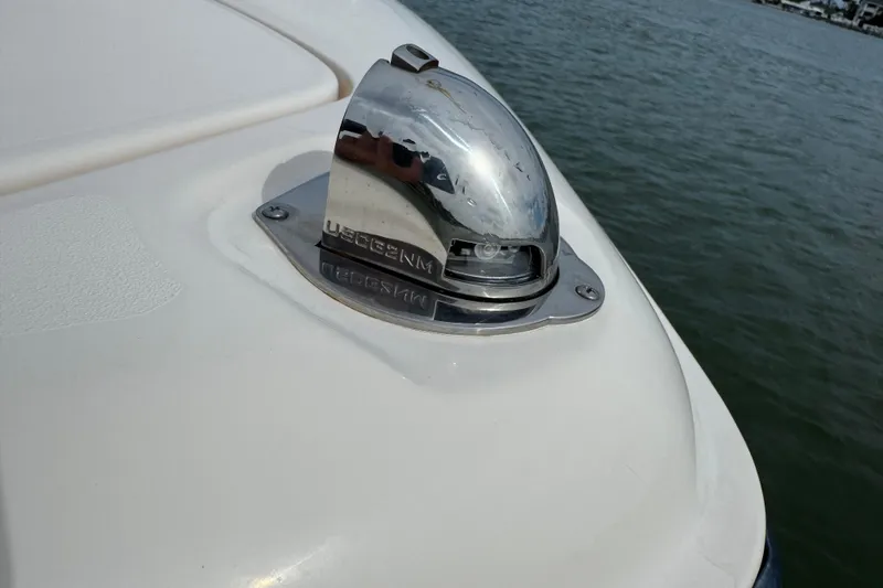 That's What She Said Yacht Photos Pics 2023 Grady-White Freedom 285 boat detail with chrome fixture by the water.