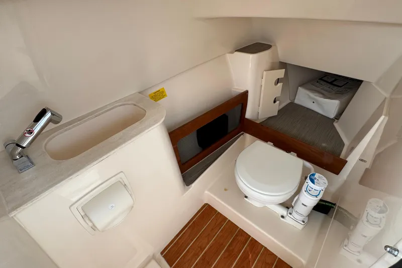 That's What She Said Yacht Photos Pics 2023 Grady-White Freedom 285 boat interior with sink and toilet.