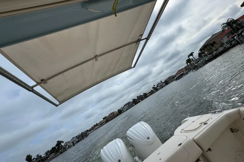 That's What She Said Yacht Photos Pics 2023 Grady-White Freedom 285 boat on water, featuring canopy and dual engines.