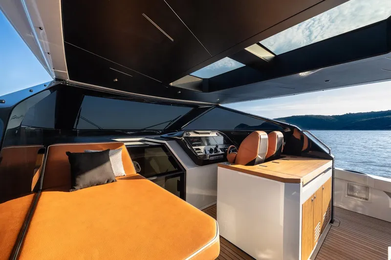  Yacht Photos Pics 2024 Wider Wilder 60 yacht interior with luxurious seating and modern design.