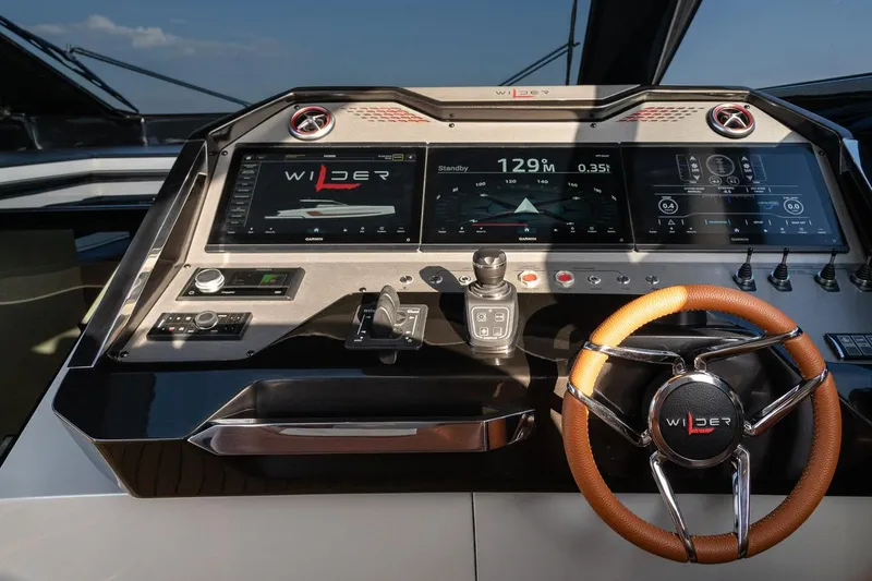  Yacht Photos Pics 2024 Wider Wilder 60 yacht dashboard with advanced navigation and control systems.