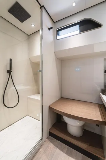  Yacht Photos Pics 2024 Wider Wilder 60 yacht bathroom with modern shower and sleek design.