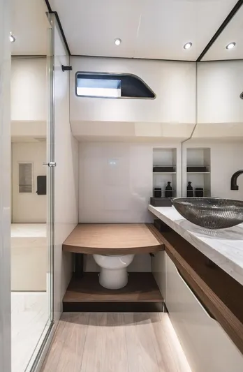  Yacht Photos Pics Luxurious bathroom in 2024 Wider Wilder 60 yacht with modern fixtures and elegant design.
