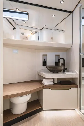  Yacht Photos Pics Luxurious bathroom in 2024 Wider Wilder 60 yacht with modern fixtures and elegant design.