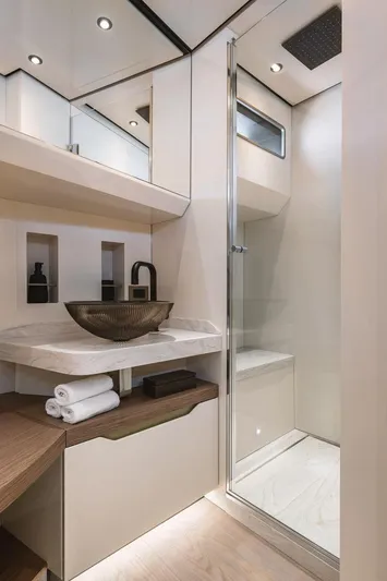  Yacht Photos Pics Luxurious bathroom in 2024 Wider Wilder 60 yacht with modern fixtures and elegant design.