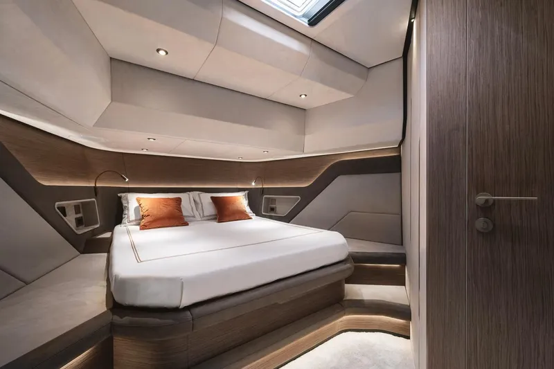  Yacht Photos Pics Luxurious cabin interior of 2024 Wider Wilder 60 yacht with modern design and cozy bedding.