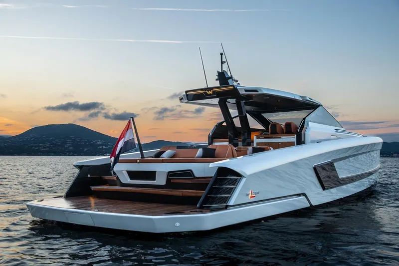  Yacht Photos Pics 2024 Wider Wilder 60 yacht at sunset on calm waters.