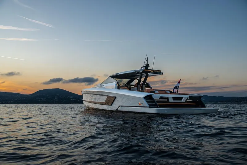  Yacht Photos Pics 2024 Wider Wilder 60 yacht at sunset on calm waters.