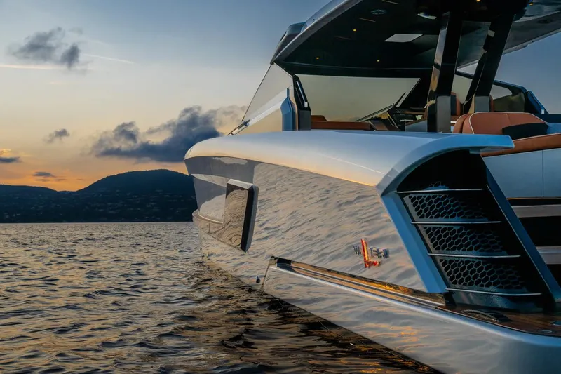  Yacht Photos Pics 2024 Wider Wilder 60 yacht on serene water at sunset.