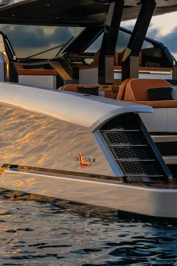  Yacht Photos Pics 2024 Wider Wilder 60 yacht with sleek design and luxurious seating on water.