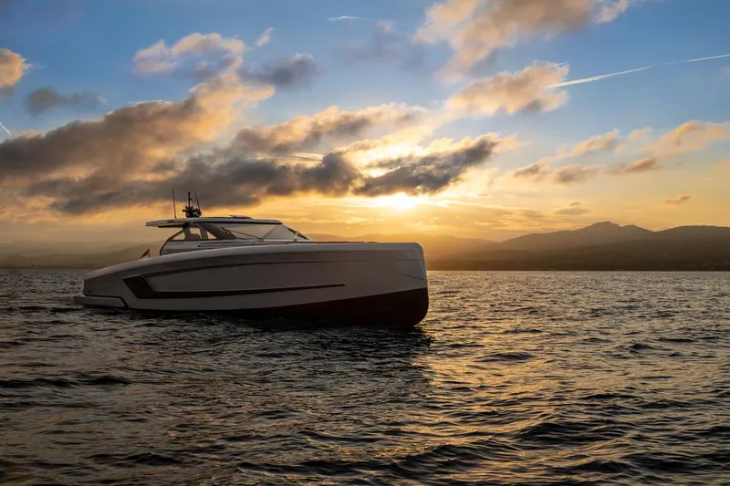  Yacht Photos Pics 2024 Wider Wilder 60 yacht at sunset on the ocean.