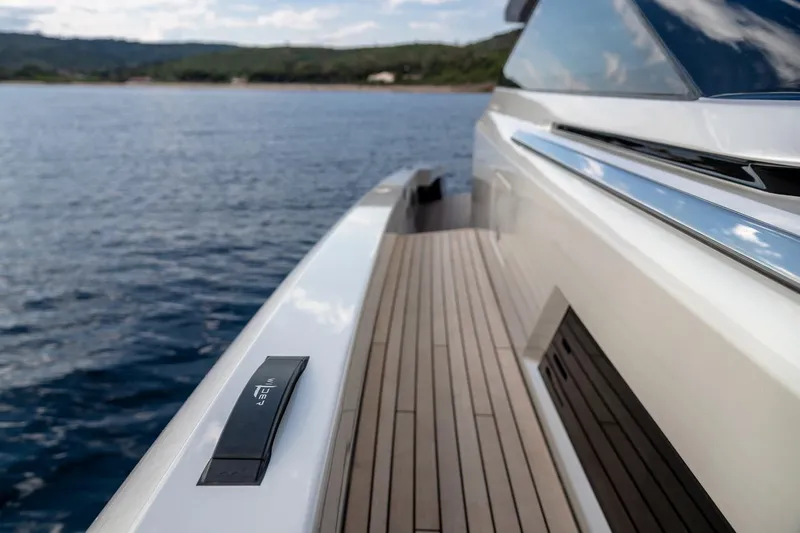  Yacht Photos Pics 2024 Wider Wilder 60 yacht deck with sleek design on calm waters.