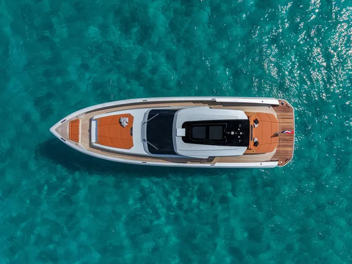  Yacht Photos Pics Aerial view of 2024 Wider Wilder 60 yacht on turquoise water.