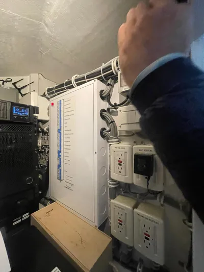 Caraibi Yacht Photos Pics Electrical panel and wiring inside a 2013 Hatteras GT63 yacht.