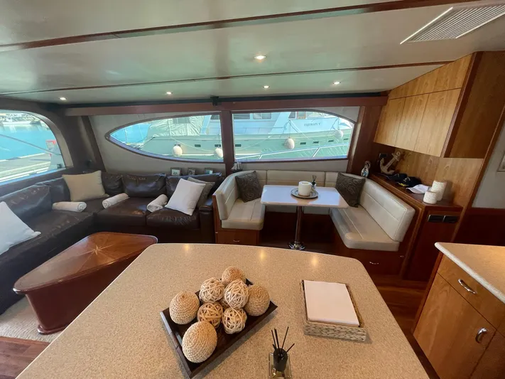 Caraibi Yacht Photos Pics Luxurious interior of 2013 Hatteras GT63 yacht with elegant seating and decor.