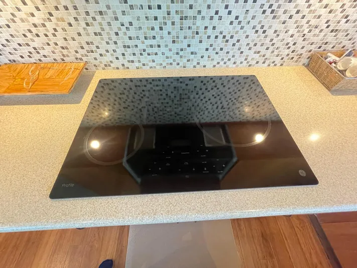 Caraibi Yacht Photos Pics Modern kitchen cooktop on a Hatteras GT63 yacht, 2013 model.