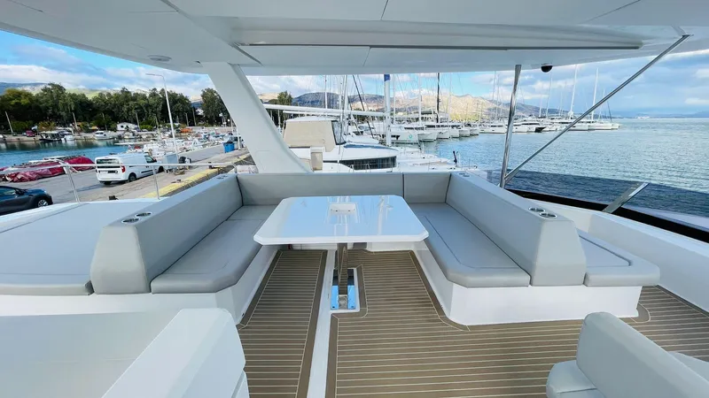  Yacht Photos Pics Luxurious 2023 Leopard 53 yacht with spacious seating and scenic marina view.