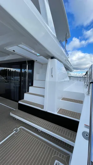  Yacht Photos Pics 2023 Leopard 53 yacht deck with modern design and sleek white finish.