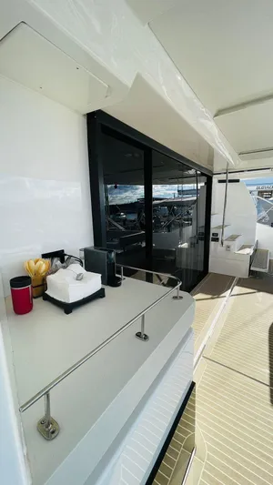  Yacht Photos Pics 2023 Leopard 53 yacht deck with modern amenities and sleek design.
