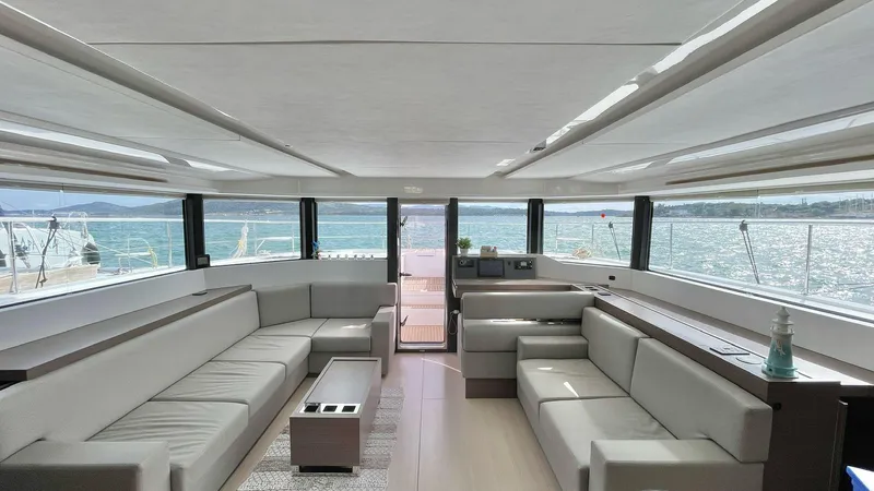 Yacht Photos Pics Luxurious interior of 2023 Leopard 53 yacht with panoramic windows and modern seating.