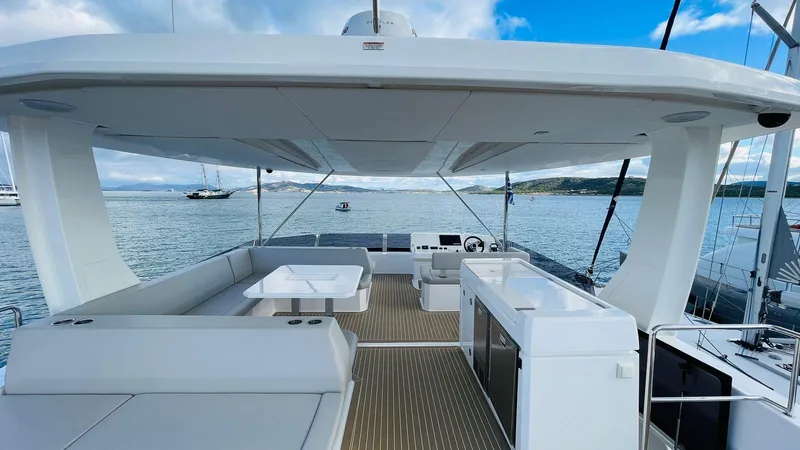  Yacht Photos Pics Luxurious 2023 Leopard 53 yacht deck with seating and ocean view.