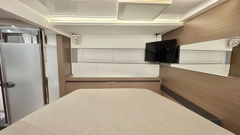  Yacht Photos Pics Modern interior of 2023 Leopard 53 yacht with TV and sleek design.