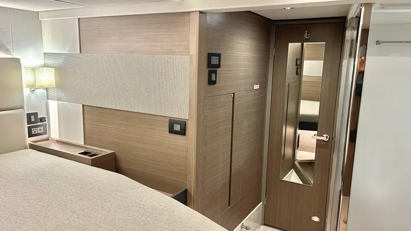  Yacht Photos Pics Luxurious interior of 2023 Leopard 53 yacht, featuring modern wood paneling and sleek design.