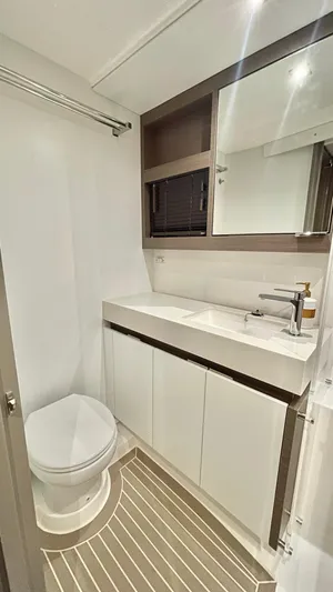  Yacht Photos Pics Modern bathroom in 2023 Leopard 53 yacht, featuring sleek fixtures and ample storage.