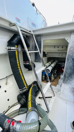  Yacht Photos Pics Engine room of 2023 Leopard 53 yacht with visible hoses and ladder.