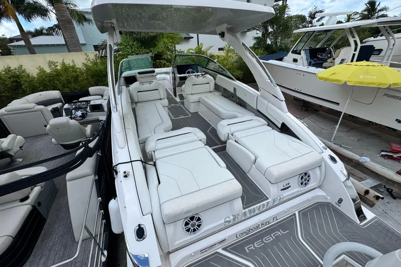  Yacht Photos Pics 2024 Regal LX9 boat with luxurious white seating and sleek design.